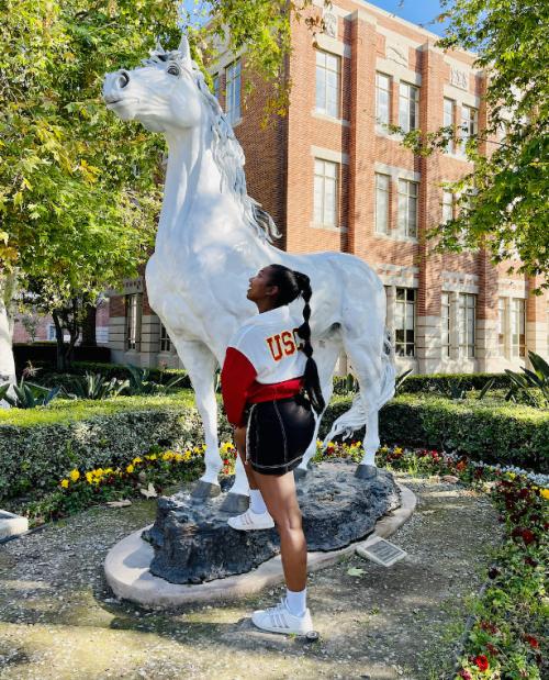 Student on the USC campus with the trojan horse